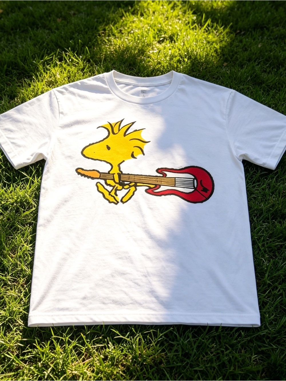White unisex T-shirt with Woodstock guitar design.